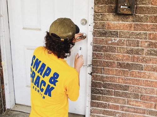 Locksmith Fixing Door Lock After a Break-In